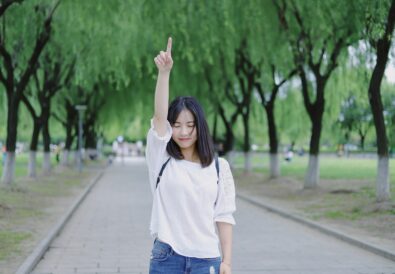 Woman pointing at the sky