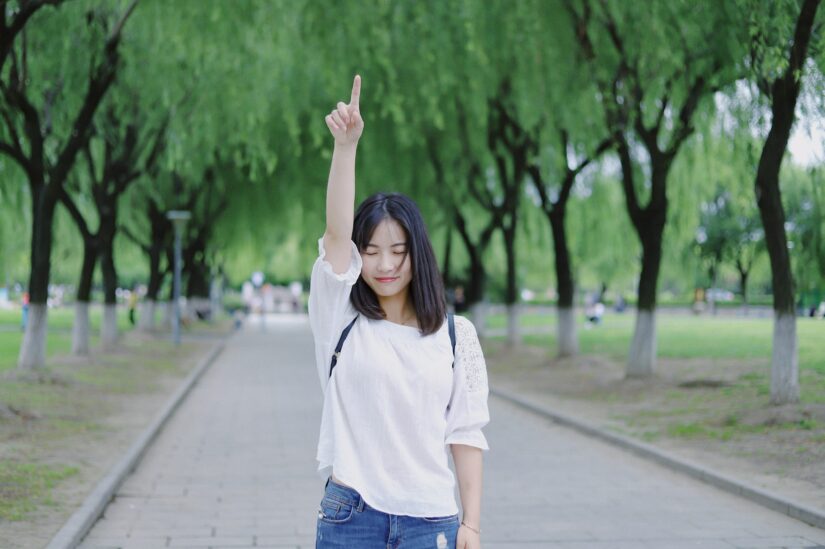 Woman pointing at the sky